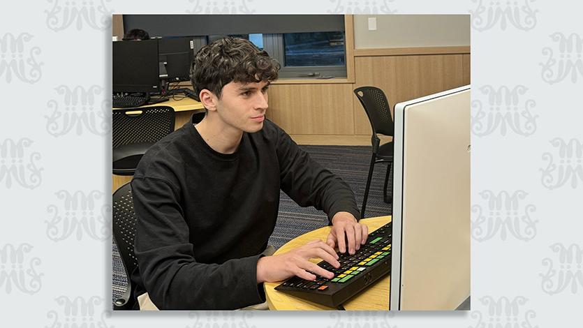 Andrew Dekhtyar ’26, pictured in the Investment Center in Dyson, joined the Mentorship Program to gain valuable insights for a future career in finance